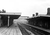 View of the litter strewn station along Platform 1 looking towards Rugby after closure