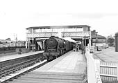 Ex-LMS Rebuilt Royal Scot Class 4-6-0 No 46143 'The South Staffordshire Regiment' stands at the up platform circa 1962