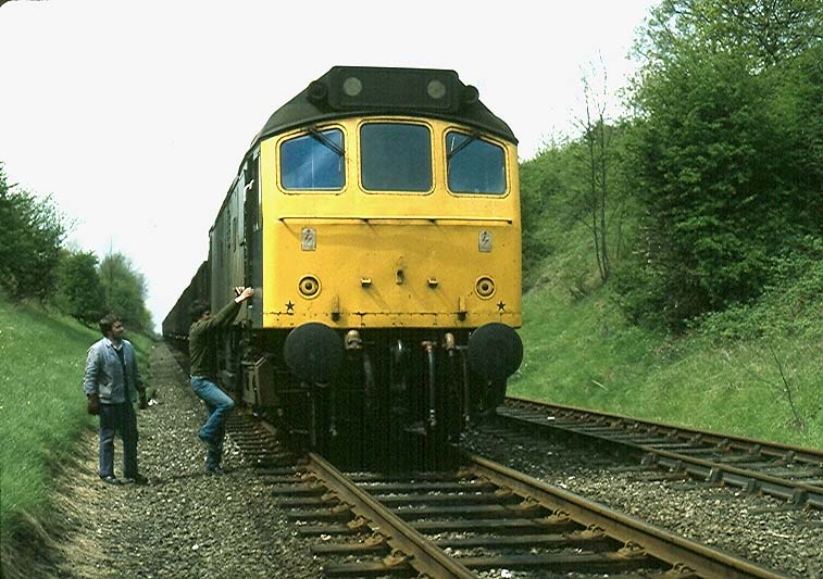 One of four photos showing D25 265 at the head of wagons being delivered and returned from Southam Cement Works in March 1982
