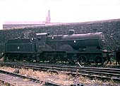 Ex-LMS 4-4-0 2P No 40678 stands with other locomotives on Monument Lane's scrapping line on 24th July 1961