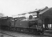 Ex-LNWR 2F 0-6-2T 'Coal Tank' No 58900 is seen on a foggy day stabled alongside Monument Lane  shed