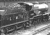 Ex-LMS 4P 4-4-0 Compound No 41166 is seen on 3rd July 1948 alongside the shed prepared for its next trip
