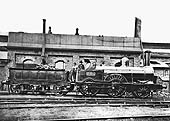 LNWR 2-4-0 Samson Class No 2153 'Isis' stands adjacent to Monument Lane shed's coaling stage and water tank
