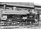 LNWR 2-4-0ST No 946 poses with its crew in front of Monument Lane's water tank and coal stage