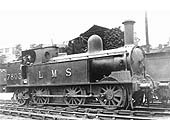 Ex-LNWR 0-6-2T 'Coal Tank' No 7803 poses for the camera in front of the shed on 1st September 1935
