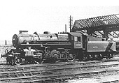 British Railways built Ivatt 4MT 2-6-0 No 43023 is seen standing outside of Nuneaton shed during reconstruction of the shed's roof