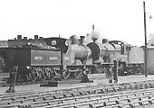 Close up showing ex-Lancashire & Yorkshire 0-6-0 3F No 52465 and ex-LMS 2P 4-4-0 No 40677 are seen standing on the coaling line