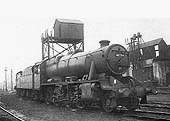 Ex-LMS 8F 2-8-0 No 48754 stands with other locomotives on one of the roads alongside the ash plant