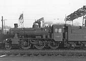 British Railways Standard Class 2MT 2-6-0 No 78019 is seen in store standing in front of Nuneaton shed