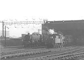Ex-LMS 3F 0-6-0 No 47479 stands with other locomotives inside Nuneaton shed during September 1962