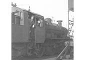 Two friends are seen cabbing BR 2MT 2-6-0 No 78019 stored adjacent to Nuneaton's Ash Plant circa January 1966