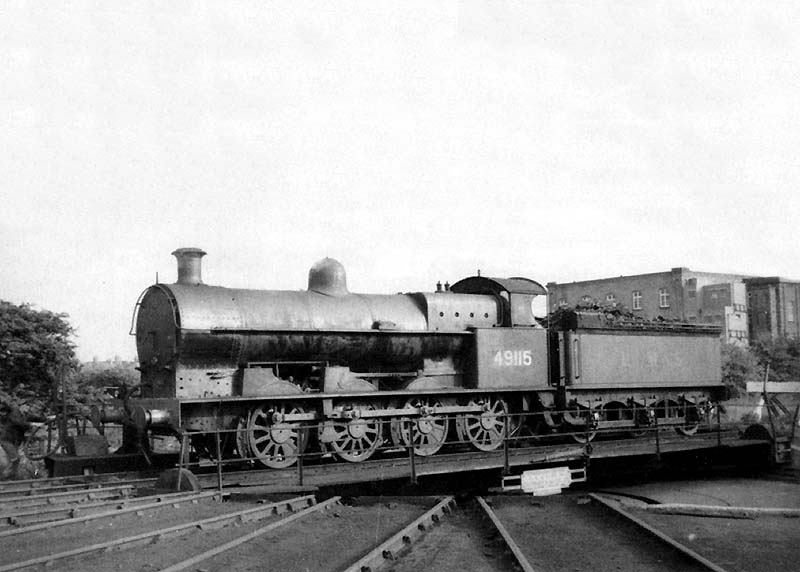 Ex-LNWR 0-8-0 7F class G2a No 49115 is seen being turned on Nuneaton shed's 60' Ransome Rapier turntable