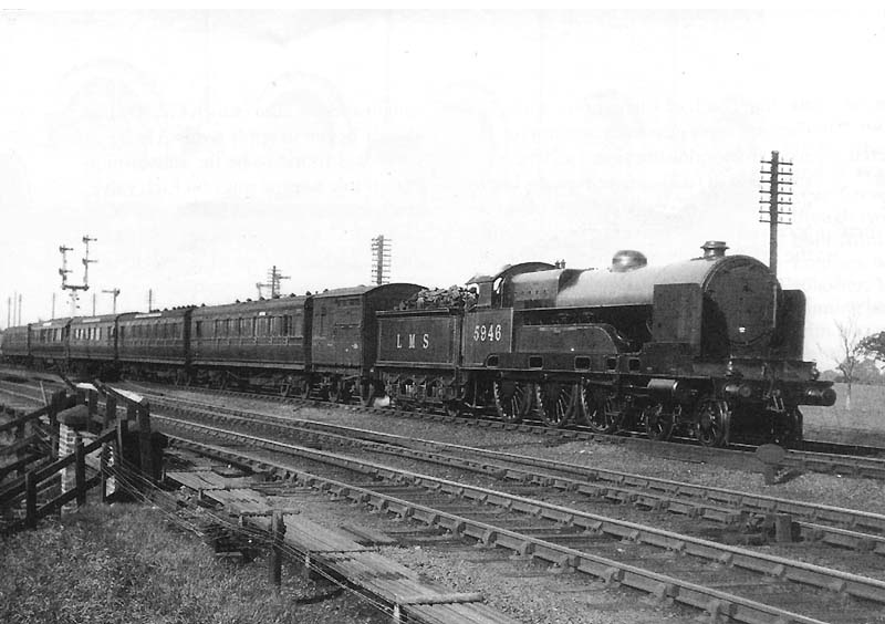 Ex-LNWR 4-6-0 No 5946 'Duke of Connaught' passes Ashby junction at the head of the up Sunny South Express