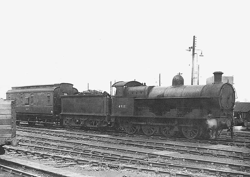 Nuneaton Station: Ex-LNWR 7F 0-8-0 G2a No 49181 is seen with anex-MR 6 ...