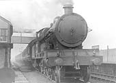An unidentified LNWR 4-6-0 Claughton class locomotive is seen passing through Polesworth on an up express service