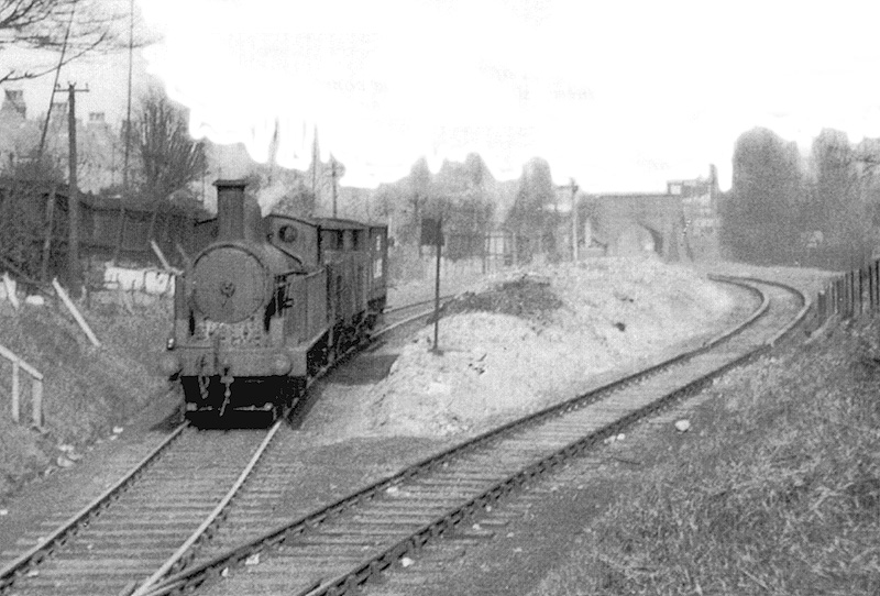 Ex-LNWR 2P 0-6-2T No 6927 passes the site of Rotton Park Road station whilst at the head of a short goods train