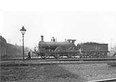 Ex-Midland Railway 2-4-0 No 128 is seen standing on the turntable with its crew on 11th April 1931