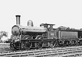 LNWR 0-6-0 'Super DX' No 3121 resplendent in its lined black livery stands in line at the shed