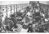 An internal view of Rugby's Fitting workshop showing several ex-LMS and BR Standard locomotives being repaired
