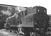 Ex-LMS 4P 2-6-4T No 42104 is seen raising steam in front of No 1 shed with David Bailey and friend in the cab