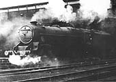 Ex-LMS 5MT 4-6-0 No 45154 is seen wreathed in smoke and steam outside Rugby No 1 shed