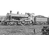 LNWR 4-4-0 George Fifth Class No 1472 'Moorhen' waits in line with other locomotives to exit the shed tender first