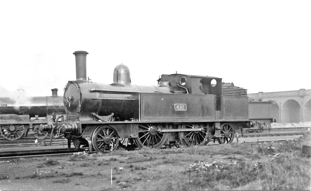 Rugby Station - LNWR 5 foot 6 inch 2-4-2T No 697 stands in front of ...