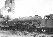 Ex-LMS 6P 4-6-0 No 46111 'Royal Fusilier' is being towed dead by ex-LMS 3F 0-6-0T No 47356 in Spring 1959
