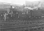 2-6-0 No 	46459 	is seen being prepared by its driver outside Rugby's new shed