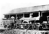 LNWR Southern Division 2-2-2 'Small Bloomer' No 602 seen posed outside one of Rugby's coke sheds circa 1868
