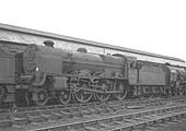 Ex-LMS 4-6-0 5XP No 45548 'Lytham St Annes' stands alongside the carriage shed on dump row on 7th July 1962