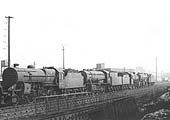 Ex-LMS 2-6-0 'Crab' No 42854 stands in line with a number of other unidentified locomotives outside of Rugby shed