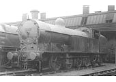 Ex-LNWR 7F Beames 0-8-4T No 7947 stands immediately in front of the shed on Valentines day in 1932