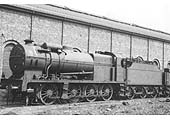 LMS Fowler 7F 0-8-0 No 9674 complete with boiler mounted water heater stands alongside the Signal Depot Yard shed