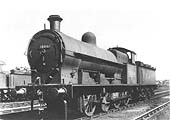 LMS 7F 0-8-0 Class G1 No 9166 is seen standing in front of No 1 shed over the inspection pits