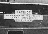 Close up showing No 5964's 'Patriot' nameplate with the sub-text remembering the LNWR employees who died in the 'Great War'
