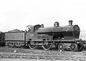 LNWR 3P 4-4-0 George V class No 1799 'Woodstock' stands on the roads outside Rugby No 2 shed ready for its next turn