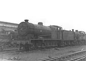 Ex-LMS 7F 0-8-0 Austin 7 stands in store with many other ex-LMS locomotives alongside the Signal Depot