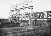 View of a LNWR 2-4-0 'Big Jumbo' class held by the signals under the GC bridge whilst at the head of a down train