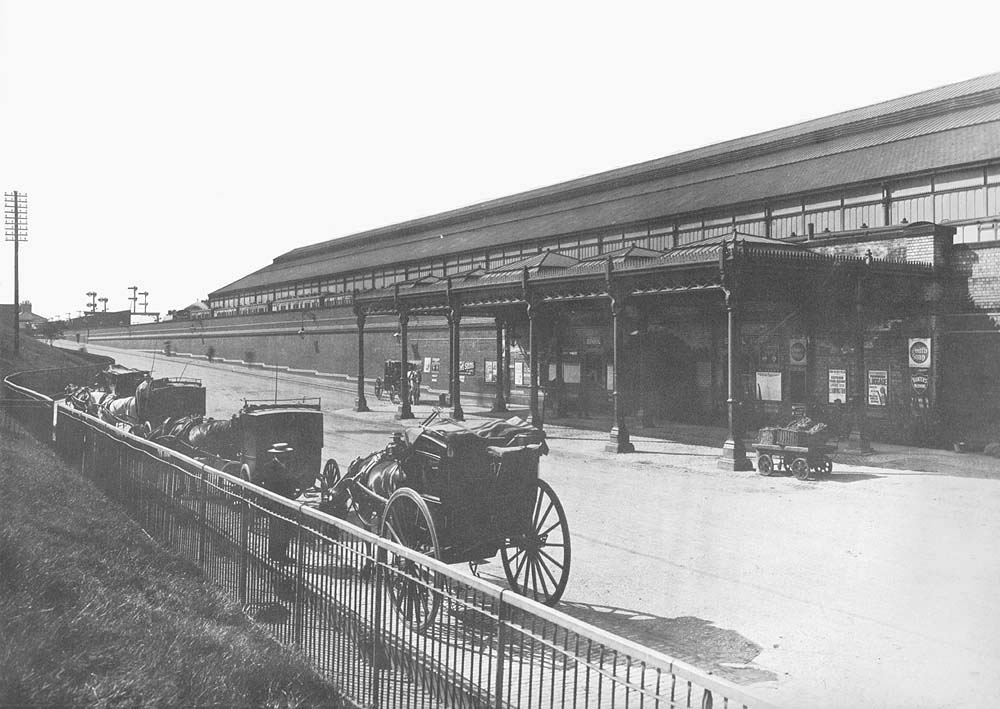 View of horse drawn cab rank and the main entrance to Rugby's third station seen on 3rd July 1906