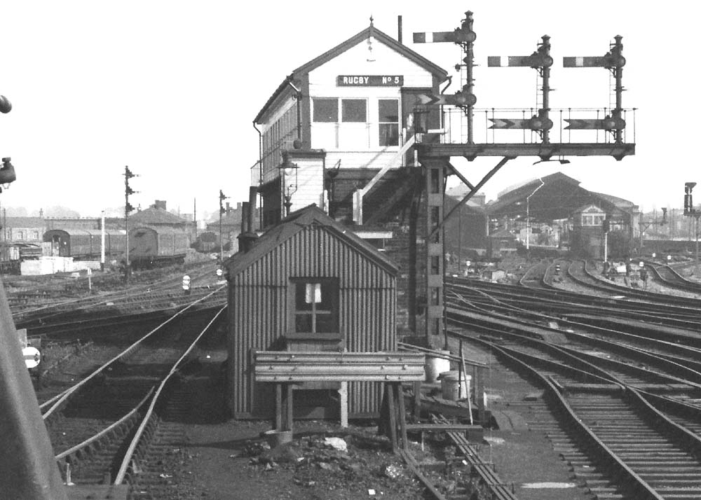 Close up showing the northern elevation of Rugby's No 5 signal cabin with the station in the background