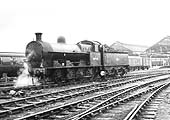 Ex-LNWR G2a 0-8-0 No 48930 is seen running tender first along the bidirectional engine line towards Rugby's sidings