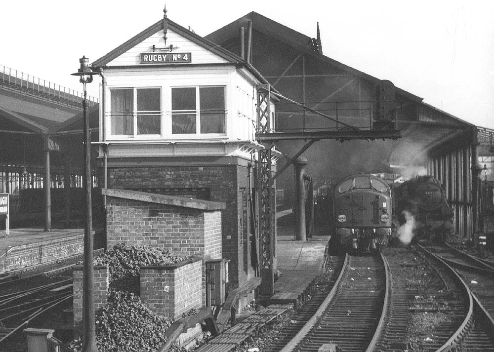 Close up showing Rugby No 4 Signal Cabin located at the end of the down platform with the Birmingham and Stafford Bay platforms to the left