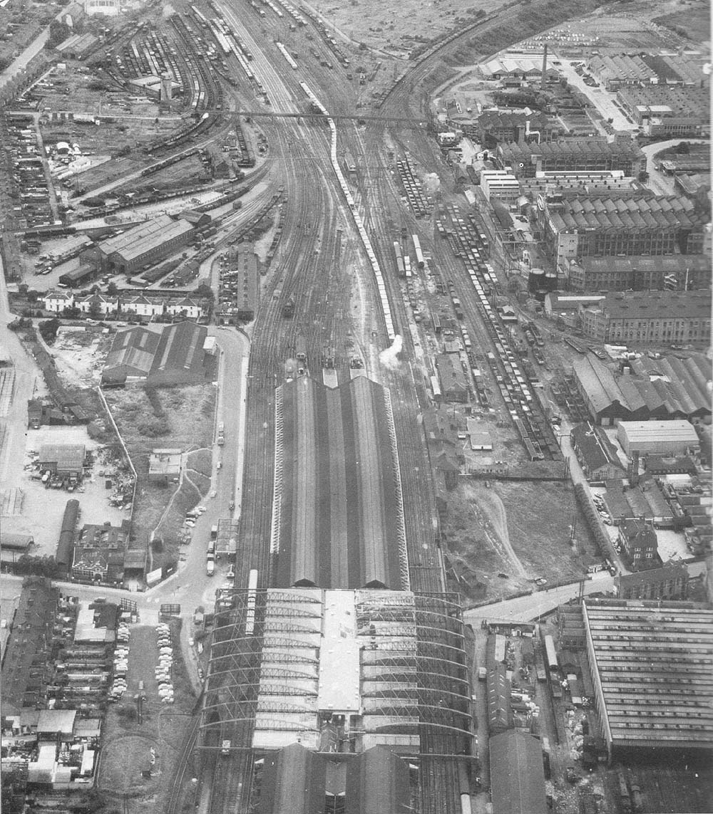 An aerial view showing Rugby station's dual width train shed and the goods yard which lay to the north of the station