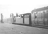 An unidentified ex-LNWR 2-4-2T tank locomotive stands at the head of a local passenger service to Leamington