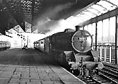 Ex-LMS 5MT 4-6-0 No 44866 is seen arriving at the down platform whilst at the head of a down stopping train