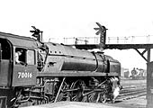 British Railways Standard Class 7 4-6-2 No 70016 'Ariel' awaits the right of way from Platform 2 on an up express circa 1960