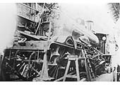 LNWR 2-2-2-0 'Dreadnought Class' No 2061 'Harpy' is seen without its cab under repair in the Erecting Workshop