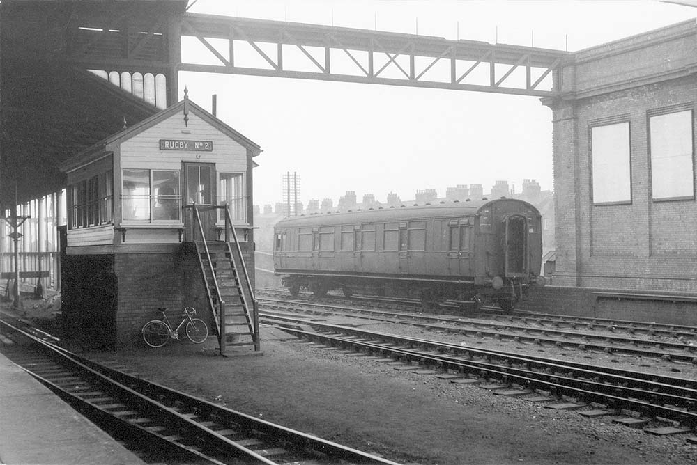 Rugby No 2 Signal Cabin seen in the early 1950s with an ex-LNWR Elliptical Roof Corridor Slip Coach stabled behind on a siding