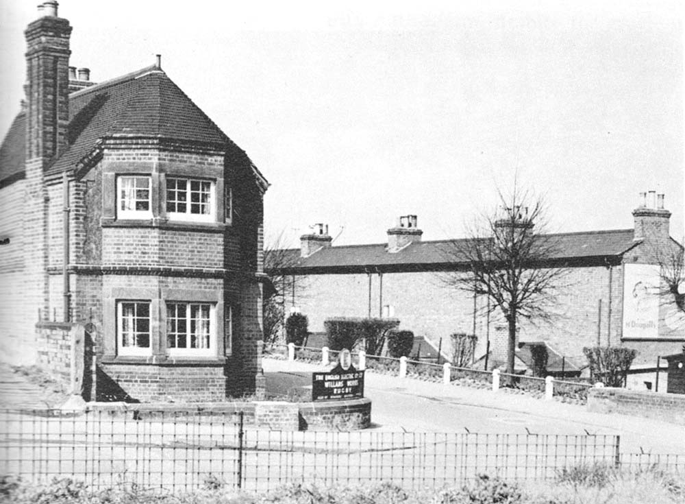 View showing on the right the rear elevation of the cottages on Old Station Square which shows the absence of windows to both floors